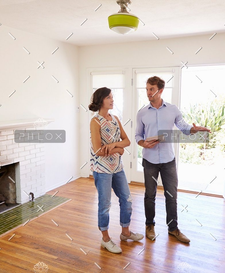 demo-attachment-41-male-realtor-showing-female-client-around-house-PXLCYLL-784x951